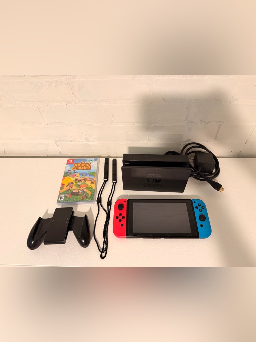 Nintendo Switch Console with Neon Red & Neon Blue Joy-Con + Animal Crossing Game